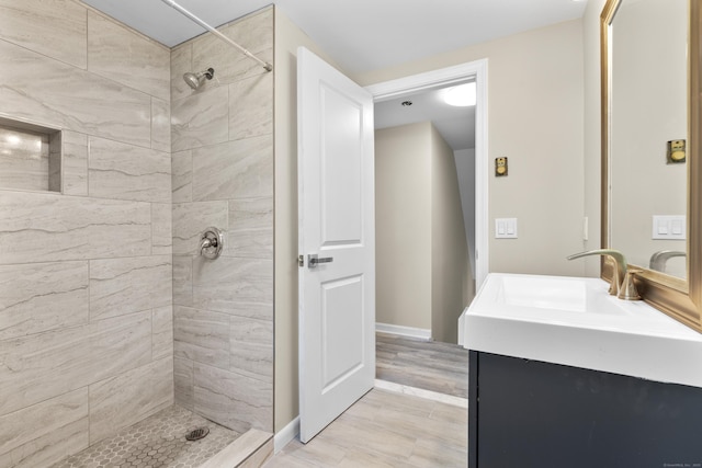 13 Williams Ct, Wolcott, CT 06716 - bathroom featuring a tile shower, vanity, and baseboards