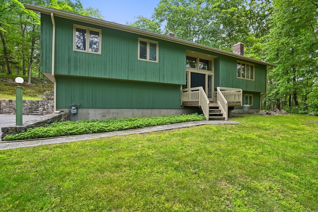 30 Bartling Dr, Easton, CT 06612 - bi-level home featuring a front lawn, a chimney, and a wooden deck
