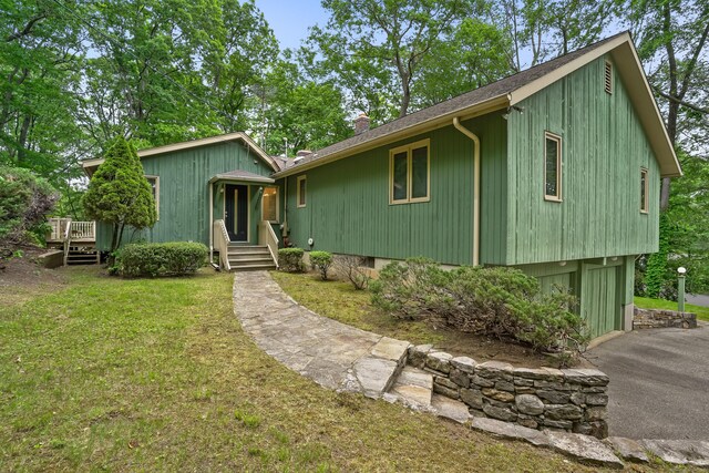 30 Bartling Dr, Easton, CT 06612 - view of front of home featuring a chimney, a shingled roof, and a front yard