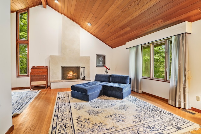 30 Bartling Dr, Easton, CT 06612 - living area featuring a high end fireplace, healthy amount of natural light, wooden ceiling with exposed beams, wood finished floors, and baseboards