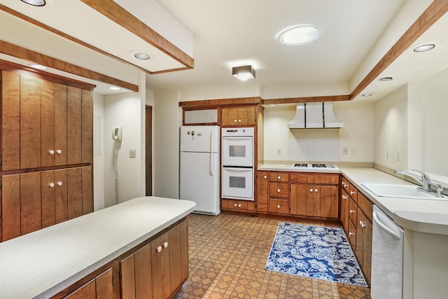 30 Bartling Dr, Easton, CT 06612 - kitchen featuring white appliances, wall chimney exhaust hood, a sink, brown cabinets, and light countertops