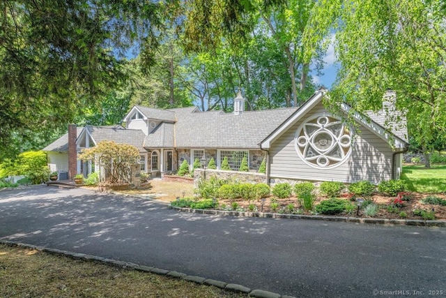 132 Old N Stamford Rd, Stamford, CT 06905 - view of front of house with stone siding and a chimney