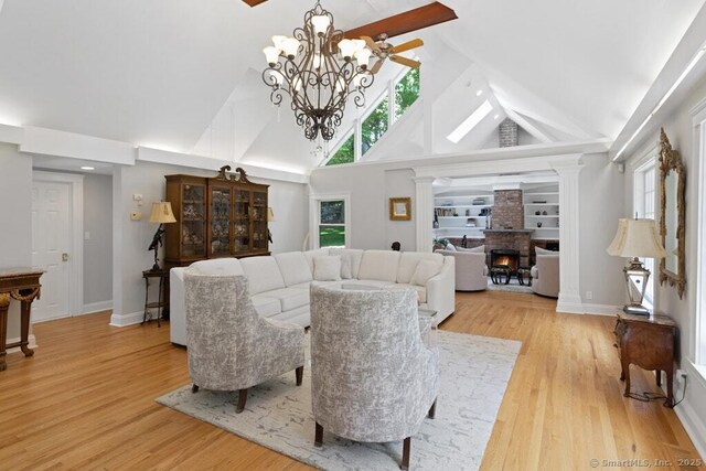 132 Old N Stamford Rd, Stamford, CT 06905 - living area with high vaulted ceiling, a chandelier, healthy amount of natural light, and light wood-style floors