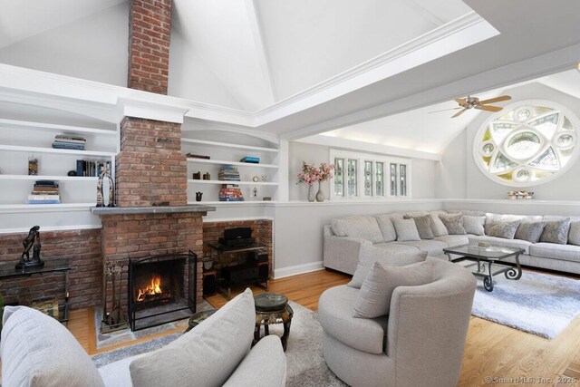 132 Old N Stamford Rd, Stamford, CT 06905 - living area featuring high vaulted ceiling, a brick fireplace, wood finished floors, ceiling fan, and baseboards