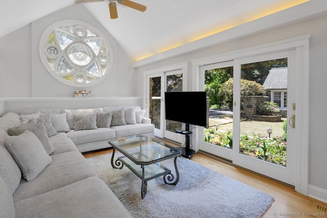132 Old N Stamford Rd, Stamford, CT 06905 - living room with healthy amount of natural light, lofted ceiling, ceiling fan, light wood-style floors, and baseboards