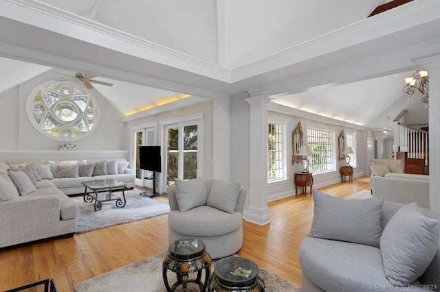 132 Old N Stamford Rd, Stamford, CT 06905 - living room with ornate columns, light wood finished floors, a ceiling fan, high vaulted ceiling, and baseboards