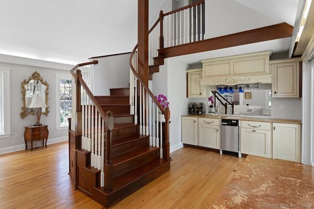 132 Old N Stamford Rd, Stamford, CT 06905 - kitchen featuring cream cabinetry, light wood-type flooring, light countertops, and baseboards