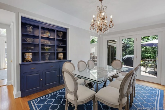132 Old N Stamford Rd, Stamford, CT 06905 - dining room with a chandelier, light wood-style floors, and french doors