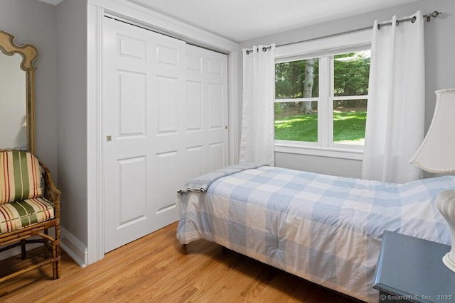 132 Old N Stamford Rd, Stamford, CT 06905 - bedroom featuring light wood finished floors, baseboards, and a closet