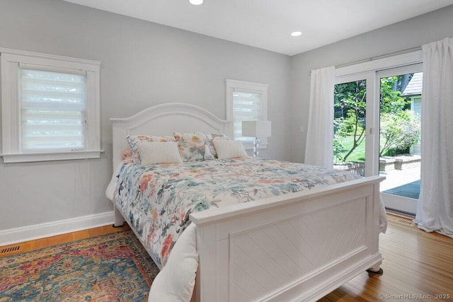 132 Old N Stamford Rd, Stamford, CT 06905 - bedroom featuring access to exterior, baseboards, wood finished floors, and recessed lighting