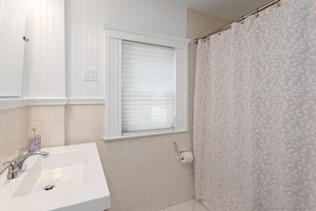 132 Old N Stamford Rd, Stamford, CT 06905 - bathroom featuring a sink, tile walls, and curtained shower