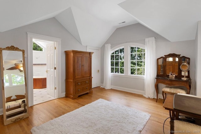132 Old N Stamford Rd, Stamford, CT 06905 - sitting room with light wood-type flooring, vaulted ceiling, and baseboards
