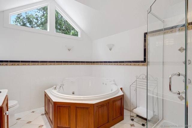 132 Old N Stamford Rd, Stamford, CT 06905 - full bathroom featuring tile walls, a jetted tub, a shower stall, plenty of natural light, and vaulted ceiling