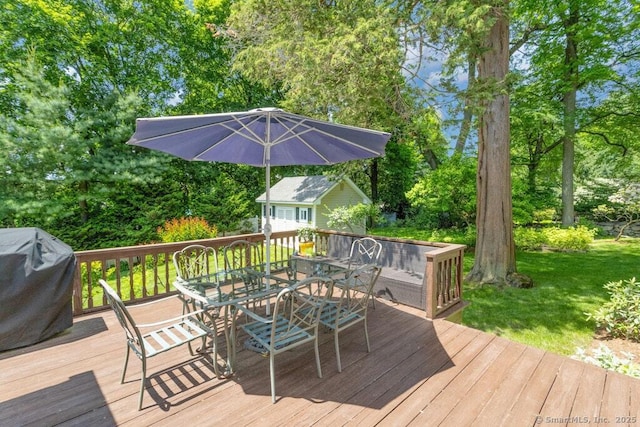 132 Old N Stamford Rd, Stamford, CT 06905 - deck with outdoor dining space, a grill, view of scattered trees, an outdoor structure, and a yard