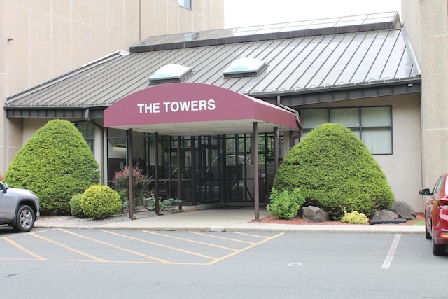 106 S Putter Dr Unit 106, Wallingford, CT 06492 - view of building exterior featuring uncovered parking