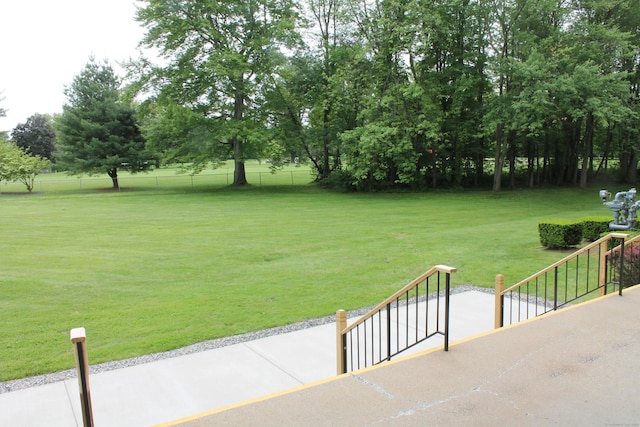 106 S Putter Dr Unit 106, Wallingford, CT 06492 - view of grassy yard featuring view of wooded area