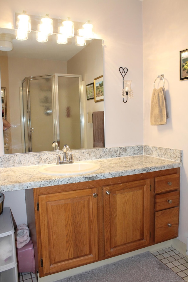 106 S Putter Dr Unit 106, Wallingford, CT 06492 - bathroom featuring a shower stall, vanity, and tile patterned flooring