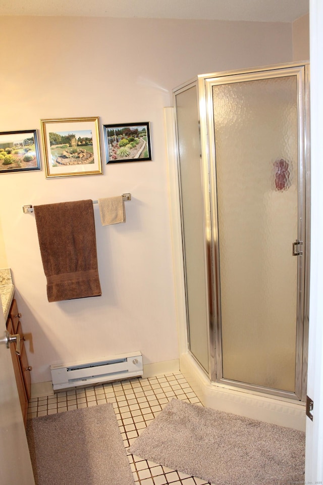 106 S Putter Dr Unit 106, Wallingford, CT 06492 - bathroom featuring a baseboard radiator, vanity, a shower stall, and tile patterned flooring