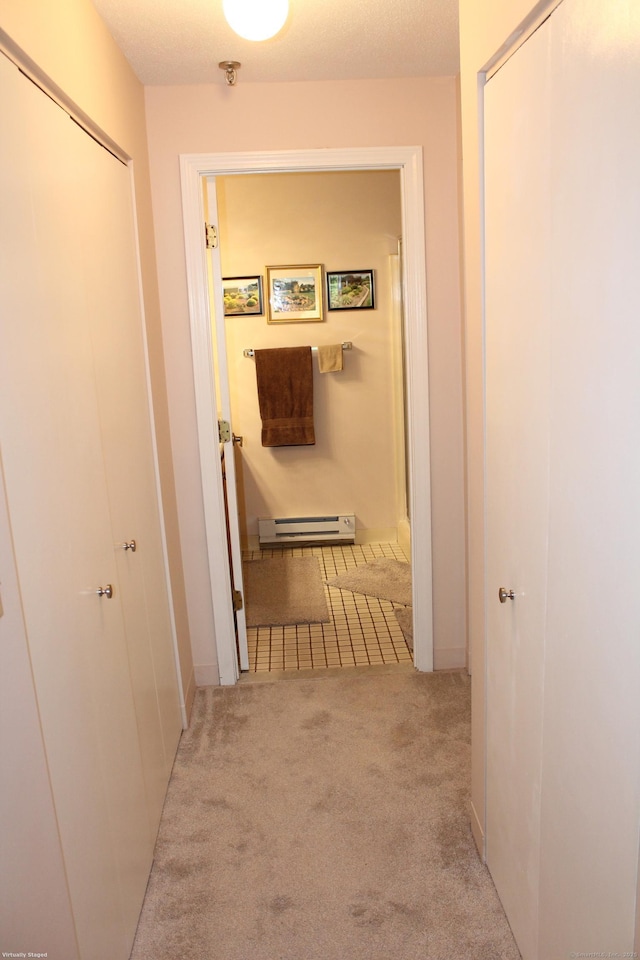 106 S Putter Dr Unit 106, Wallingford, CT 06492 - hallway featuring baseboard heating, carpet flooring, and baseboards