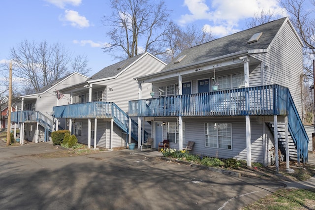 19 Fairmont Ave, New Haven, CT 06513 - view of front of house with stairs, roof with shingles, and a deck
