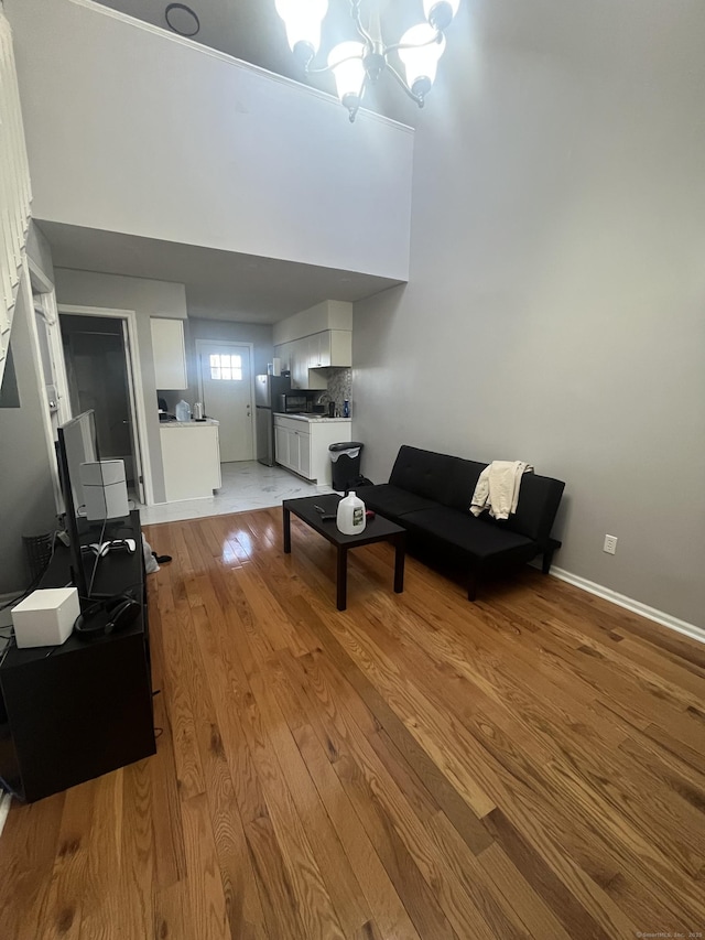 19 Fairmont Ave, New Haven, CT 06513 - living area with wood finished floors, a chandelier, and a desk