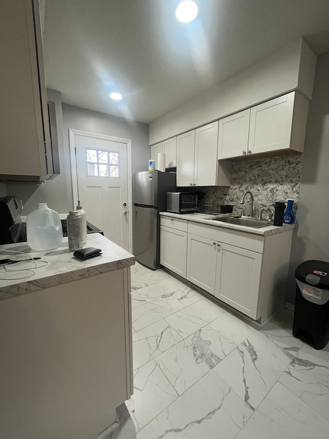 19 Fairmont Ave, New Haven, CT 06513 - kitchen with freestanding refrigerator, black microwave, light marble finish floors, tasteful backsplash, and recessed lighting