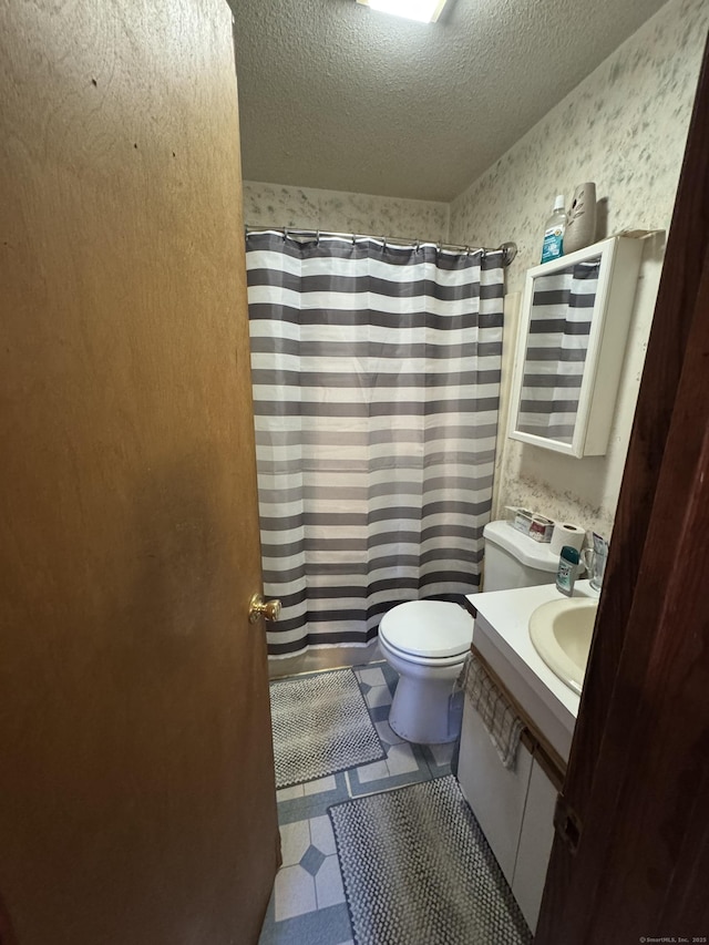 19 Fairmont Ave, New Haven, CT 06513 - bathroom with vanity, curtained shower, a textured ceiling, and tile patterned floors