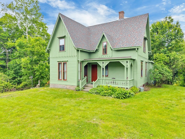 187 Whitehall Ave, Stonington, CT 06355 - victorian home with covered porch, a chimney, a shingled roof, and a front yard