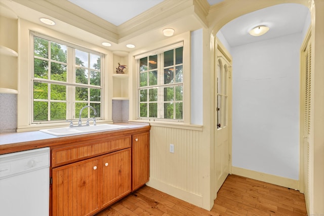 187 Whitehall Ave, Stonington, CT 06355 - kitchen with white dishwasher, open shelves, arched walkways, a sink, and light wood-type flooring