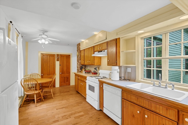 187 Whitehall Ave, Stonington, CT 06355 - kitchen with white appliances, a sink, under cabinet range hood, light countertops, and light wood finished floors