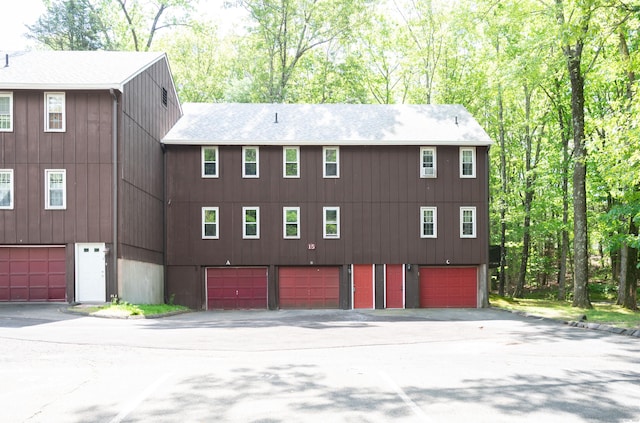 239 Old Farms Rd Apt 15B, Avon, CT 06001 - view of front of home featuring driveway, a shingled roof, and an attached garage