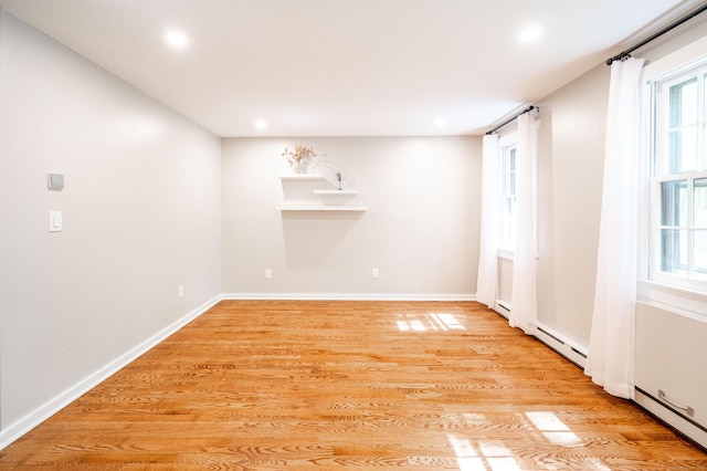 239 Old Farms Rd Apt 15B, Avon, CT 06001 - unfurnished room with light wood-style flooring, recessed lighting, baseboards, and a baseboard radiator