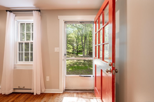239 Old Farms Rd Apt 15B, Avon, CT 06001 - doorway to outside featuring wood finished floors, baseboard heating, and baseboards