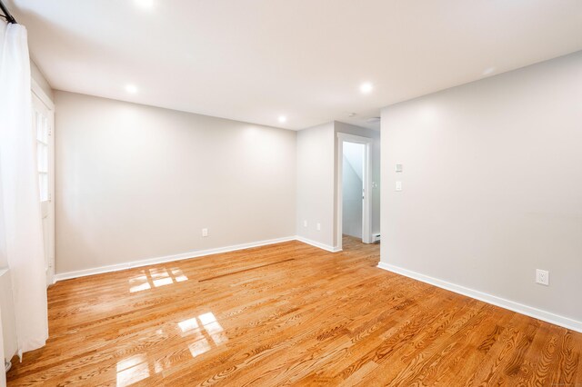 239 Old Farms Rd Apt 15B, Avon, CT 06001 - unfurnished room featuring baseboards, light wood finished floors, and recessed lighting