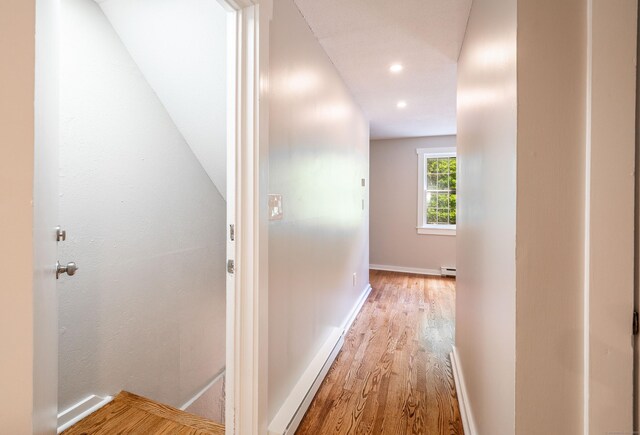 239 Old Farms Rd Apt 15B, Avon, CT 06001 - hallway with wood finished floors, baseboard heating, baseboards, and recessed lighting