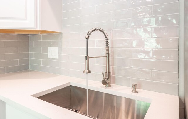 239 Old Farms Rd Apt 15B, Avon, CT 06001 - kitchen view of decorative backsplash, a sink, and light countertops
