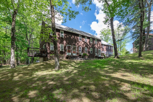239 Old Farms Rd Apt 15B, Avon, CT 06001 - rear view of house with a wooden deck and a lawn