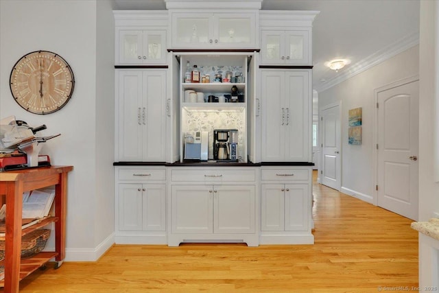 2 Lake Louise Dr, Westbrook, CT 06498 - bar with light wood-type flooring, crown molding, and baseboards