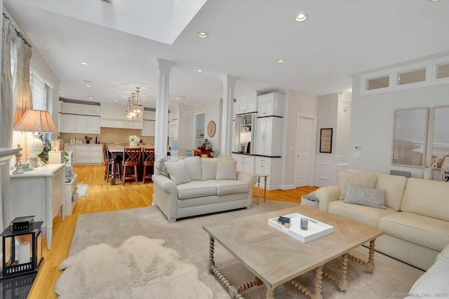 2 Lake Louise Dr, Westbrook, CT 06498 - living area with decorative columns, light wood-style flooring, and recessed lighting