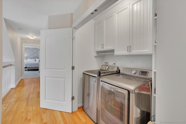 2 Lake Louise Dr, Westbrook, CT 06498 - washroom with cabinet space, washer and dryer, and light wood-style flooring