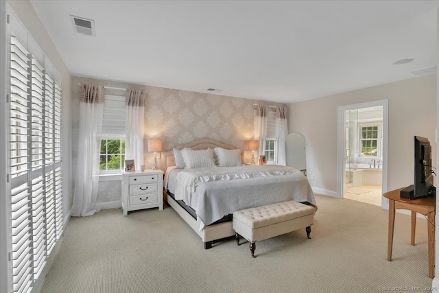 2 Lake Louise Dr, Westbrook, CT 06498 - bedroom featuring wallpapered walls, light carpet, multiple windows, connected bathroom, and baseboards