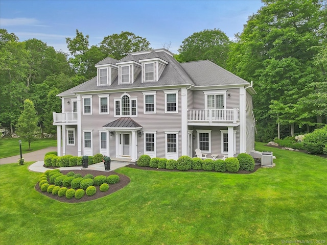 2 Lake Louise Dr, Westbrook, CT 06498 - view of front of property featuring a balcony, central AC, and a front lawn