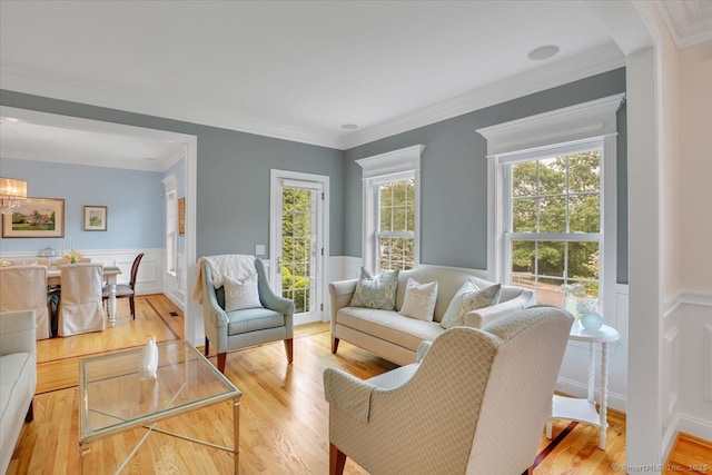 2 Lake Louise Dr, Westbrook, CT 06498 - living room with wainscoting, wood finished floors, a decorative wall, and crown molding