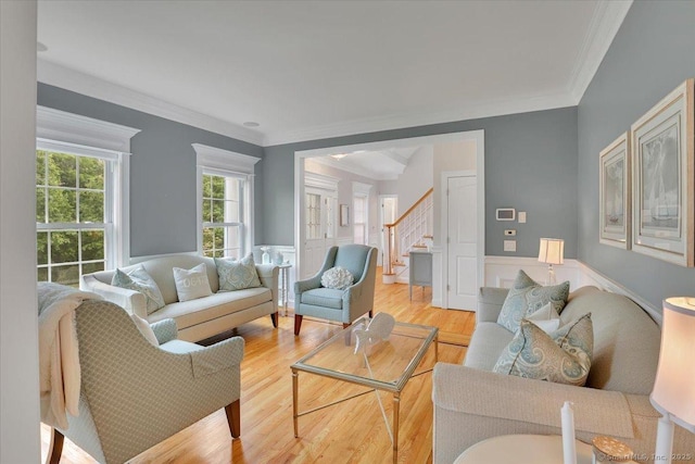 2 Lake Louise Dr, Westbrook, CT 06498 - living area featuring stairway, light wood-type flooring, ornamental molding, and wainscoting
