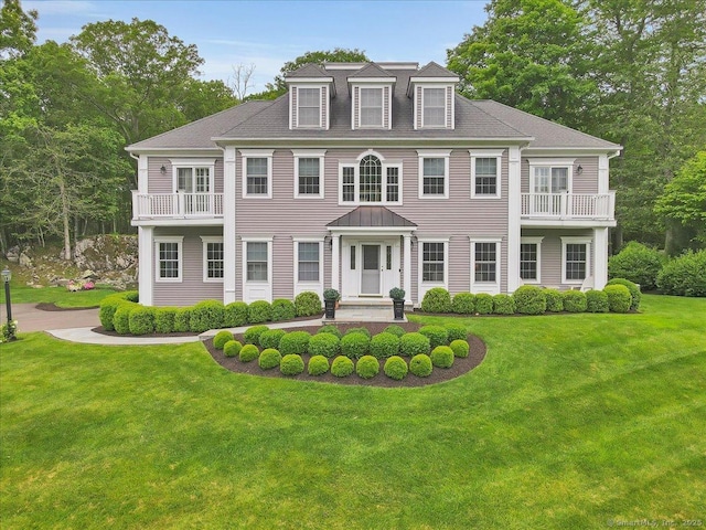 2 Lake Louise Dr, Westbrook, CT 06498 - colonial inspired home featuring a front lawn and a balcony