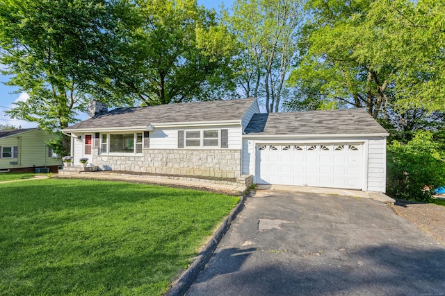 20 Karen Rd, Danbury, CT 06811 - view of front of home with stone siding, asphalt driveway, a front yard, a chimney, and a garage