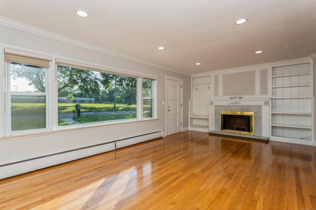 20 Karen Rd, Danbury, CT 06811 - unfurnished living room with a baseboard radiator, wood finished floors, crown molding, recessed lighting, and a tile fireplace