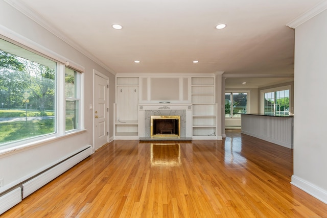 20 Karen Rd, Danbury, CT 06811 - unfurnished living room featuring a baseboard heating unit, ornamental molding, light wood-style floors, healthy amount of natural light, and a fireplace