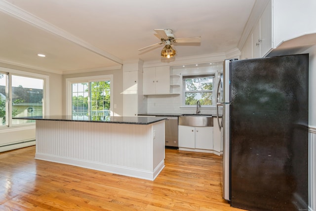20 Karen Rd, Danbury, CT 06811 - kitchen featuring appliances with stainless steel finishes, light wood finished floors, white cabinets, crown molding, and recessed lighting