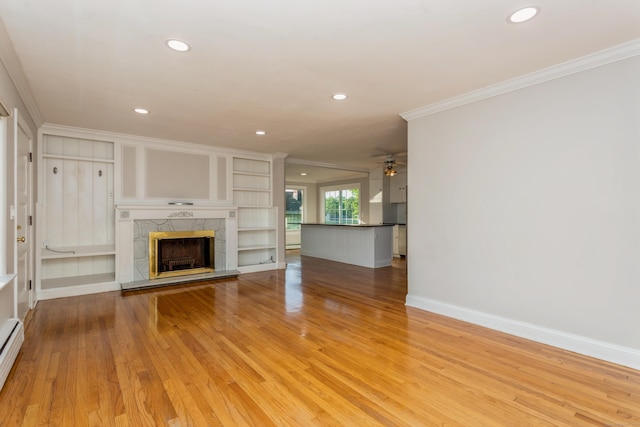 20 Karen Rd, Danbury, CT 06811 - unfurnished living room featuring ornamental molding, recessed lighting, light wood finished floors, a tiled fireplace, and ceiling fan